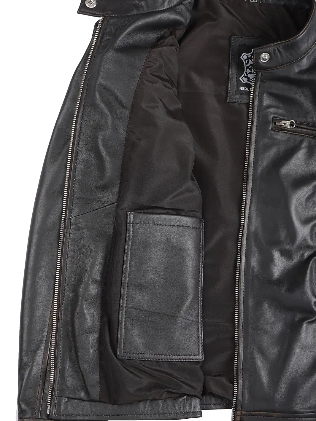 Close-up of a black leather jacket with zippers and pockets on a white background